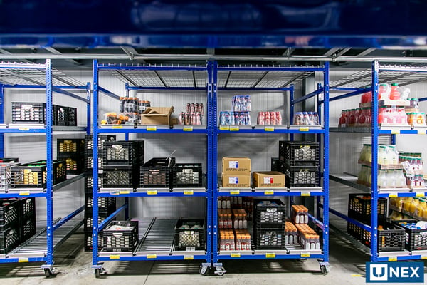 UNEX FIFO Storage Racks in Dairy Cooler